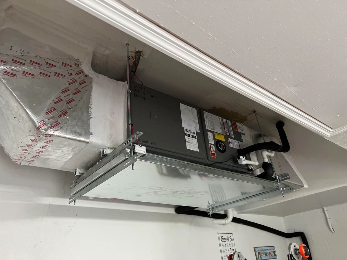 Ceiling-mounted air handler installation in a garage by Lightning Fast A/C & Heating near FishHawk, Lithia FL