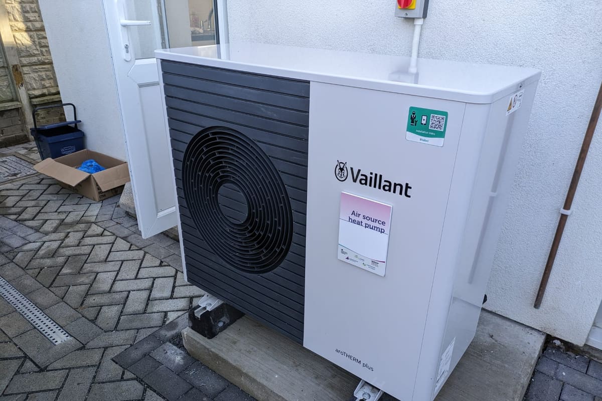 Newly installed air source heat pump outside a home for year-round heating and cooling, Lightning Fast A/C & Heating, Valrico FL